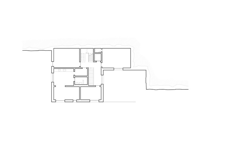 Floor plan drawing showing rooms arranged around a central staircase with exterior terrace