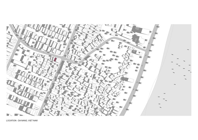 Site plan drawing showing dense urban fabric bordered by a waterfront promenade with scattered trees