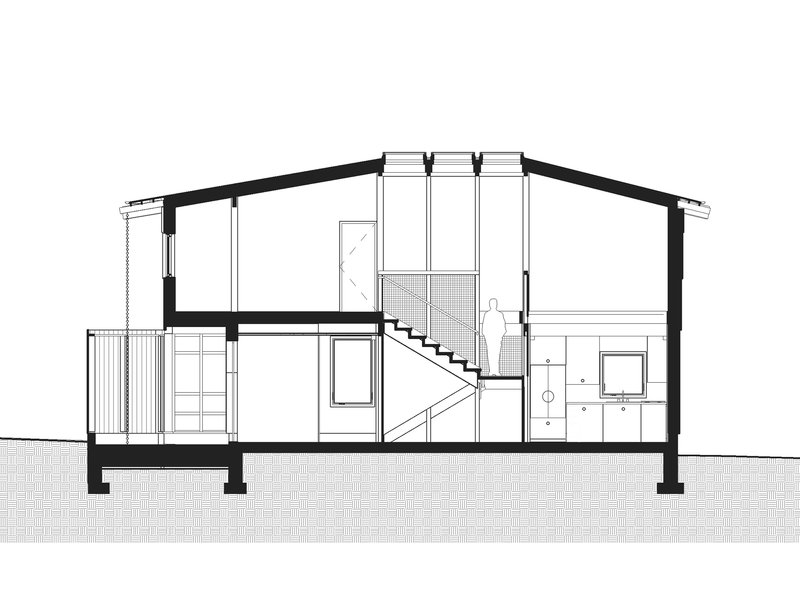 Section drawing showing the sloped roof structure and central staircase with a figure for scale