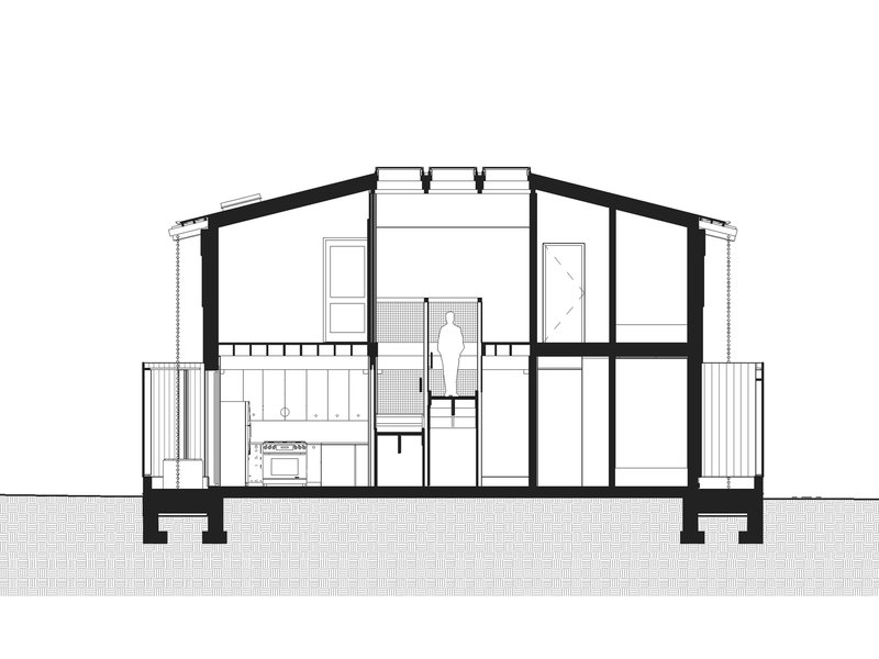 Transverse section drawing revealing two-story spatial organization with roof monitors and exterior balconies