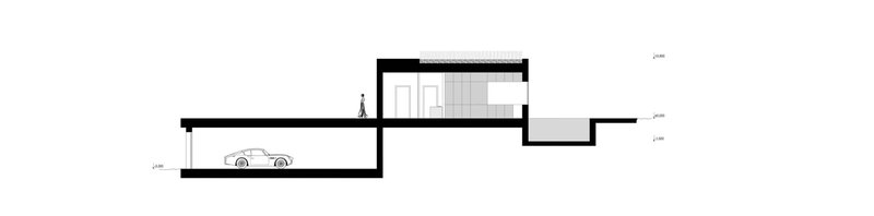 Section drawing showing split-level spaces with garage below and living areas above grade