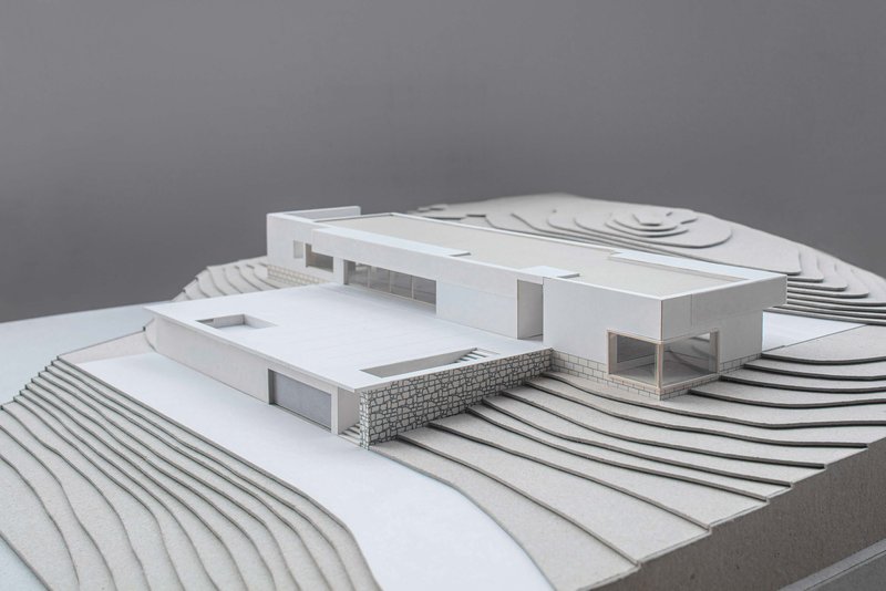 Physical model showing horizontal volumes on terraced topography with contour-like steps and platforms