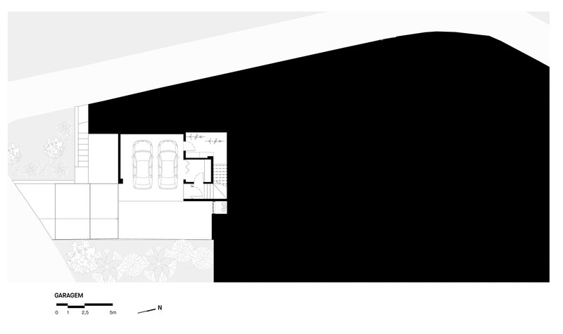 Floor plan drawing showing garage level with two parking spaces and stairs to upper floors