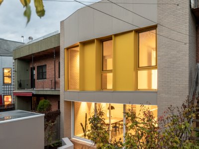 NatureHumaine Wraps a Montréal Family Home in Yellow Accents and Double-Height Light