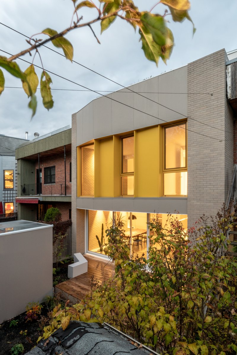 NatureHumaine Wraps a Montréal Family Home in Yellow Accents and Double-Height Light