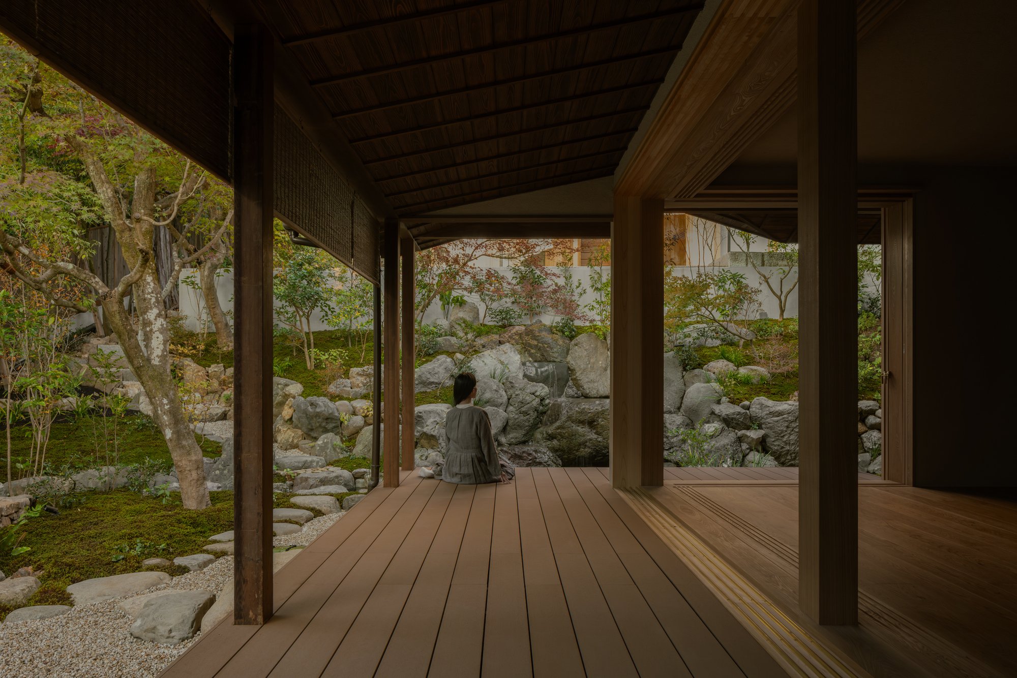 kooo architects Strip a Kyoto Sukiya House Back to Its Roots and Add a Garden Waterfall Between Buildings