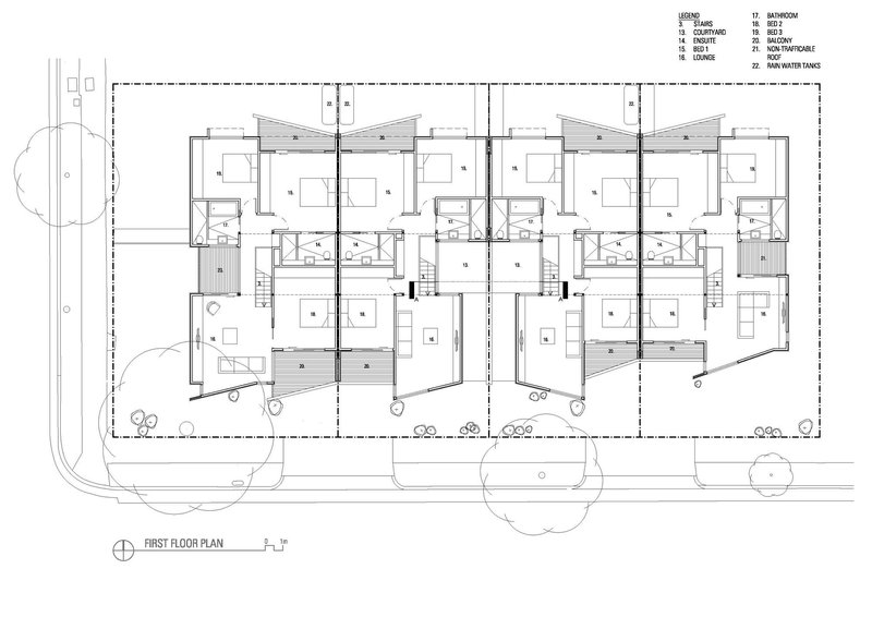 First floor plan drawing showing four units with bedrooms, bathrooms, and sloped roof lines