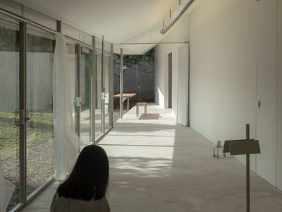 dua studio Stretches a 3.6-Meter-Wide House Across 24 Meters of Indonesian Garden
