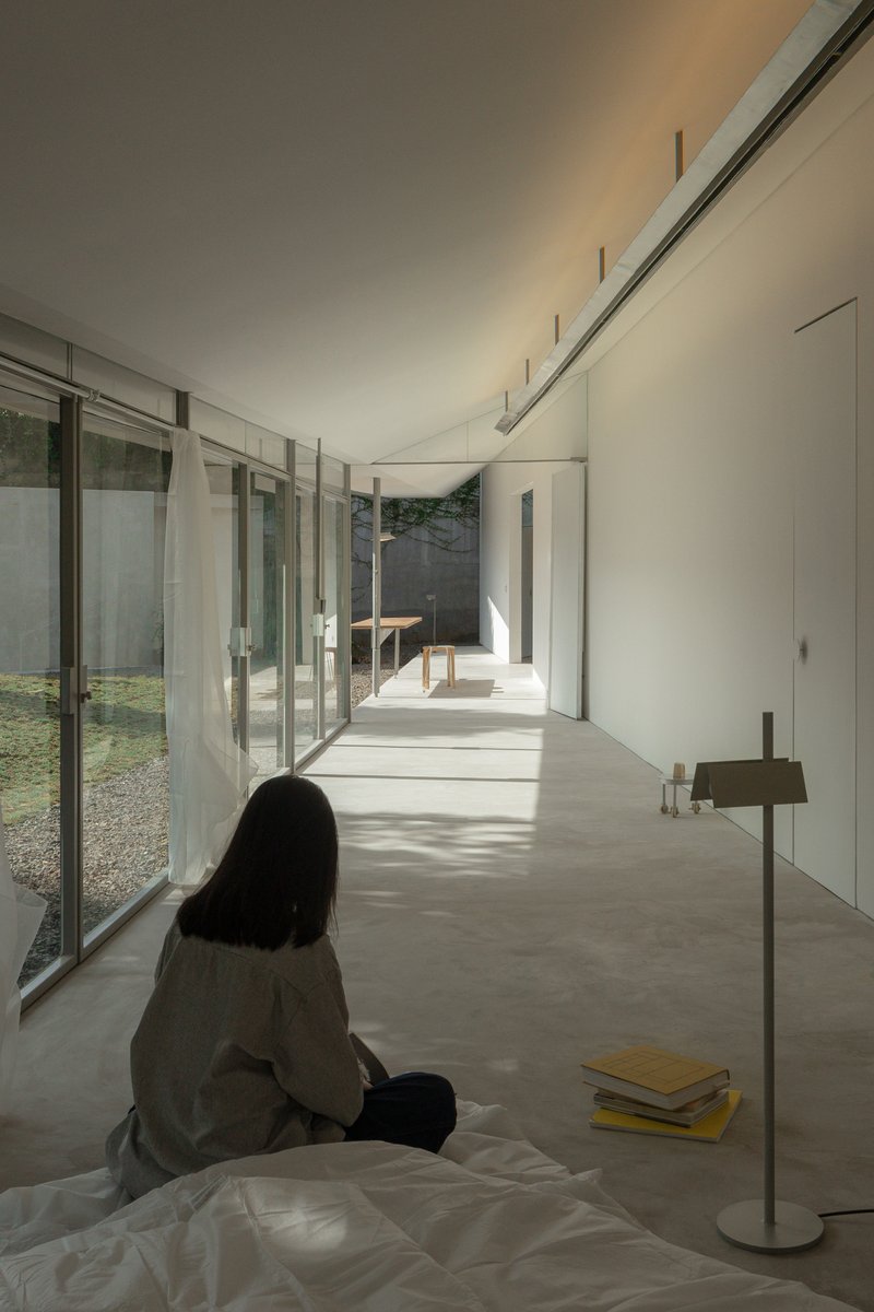 dua studio Stretches a 3.6-Meter-Wide House Across 24 Meters of Indonesian Garden
