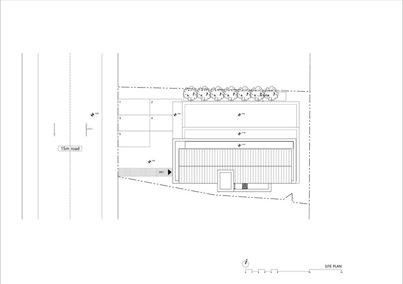 Site plan showing a rectangular building volume with row of trees along the street edge