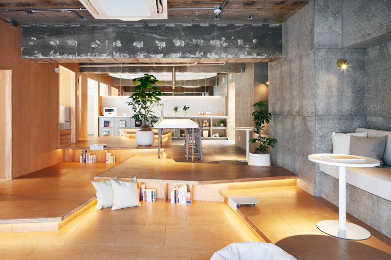 Sunken plywood lounge area with integrated book storage and pendant lighting overhead