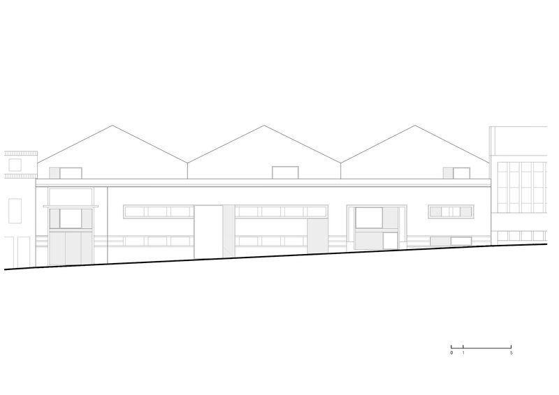 Elevation drawing displaying a sequence of gabled residential units with varied window openings and ground floor transparency