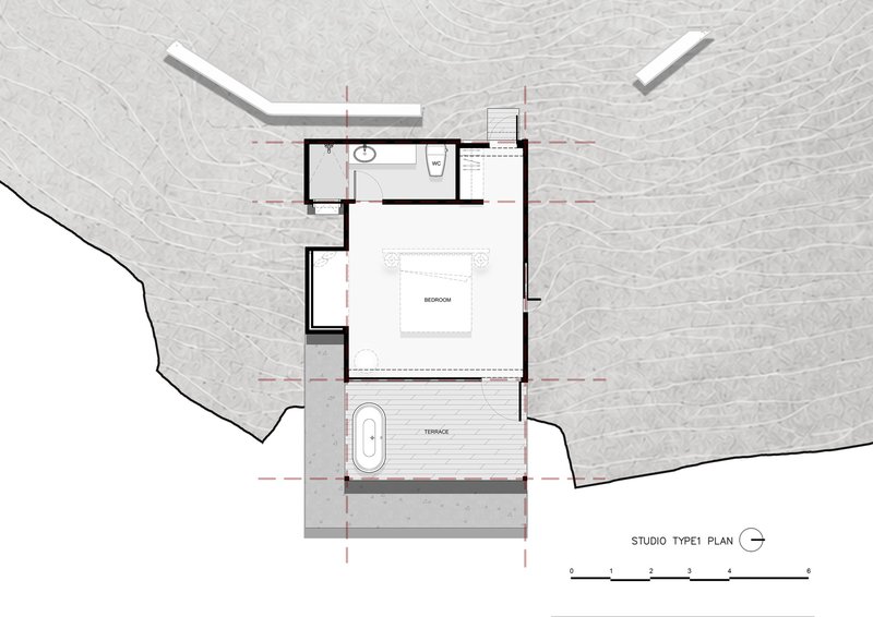 Studio floor plan drawing showing bedroom with bathroom and outdoor terrace with freestanding bath