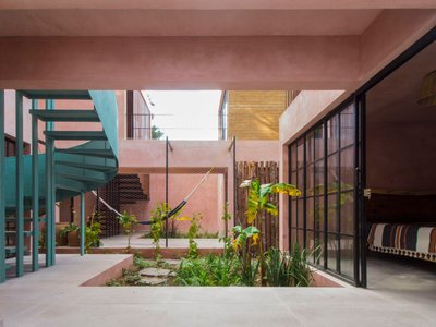 Apaloosa Builds a Forest-Edge Retreat from Compacted Earth and Pink Stucco in Chiapas
