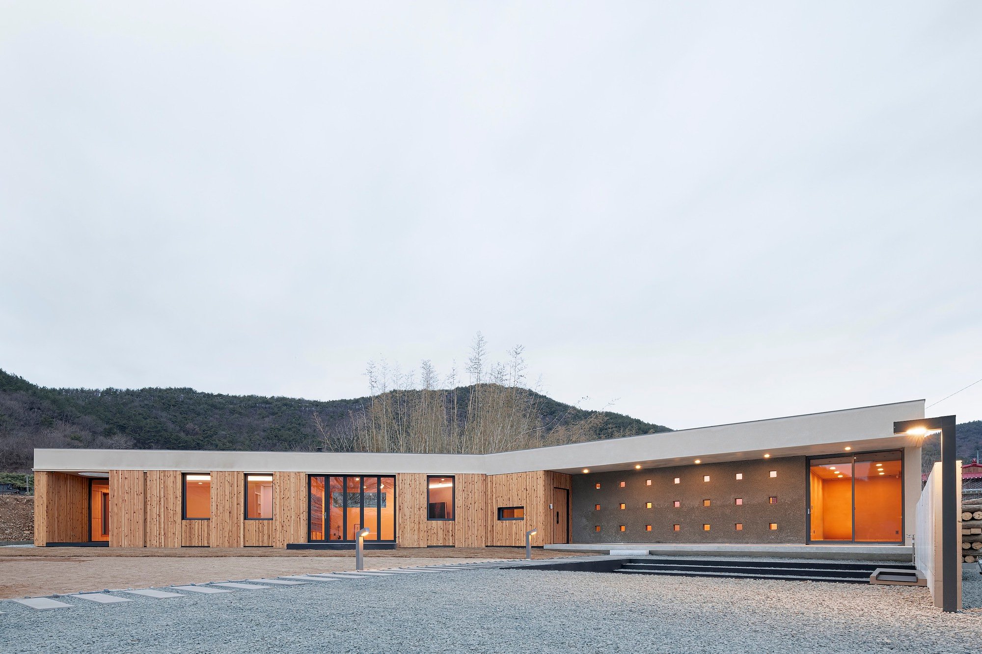 TURTLE Architects Anchors a Concrete House Around an Ancient Well and a Bronze Age Dolmen