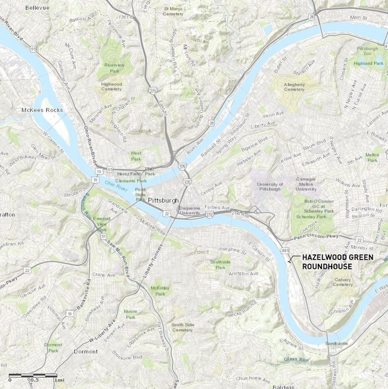 Site map showing the building location along a river bend with surrounding parks and roadways