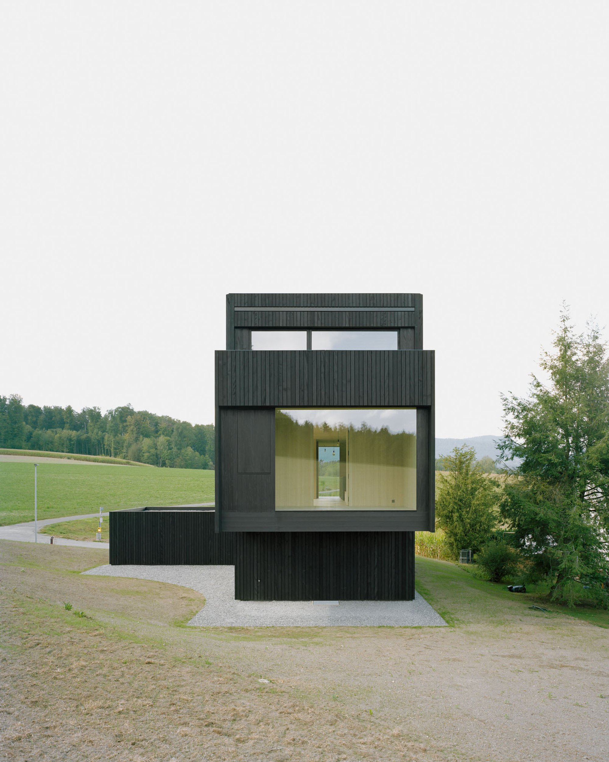 Gautschi Lenzin Schenker Architekten Plant a Cedar Tower at the Edge of Aarau's Agricultural Zone