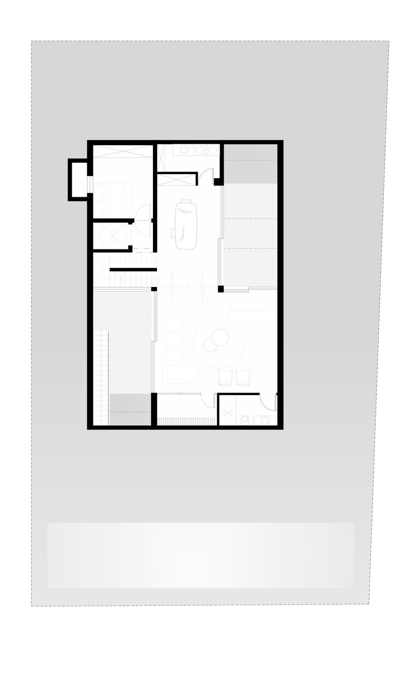 Floor plan showing a rectangular residence with multiple rooms and a bath fixture indicated