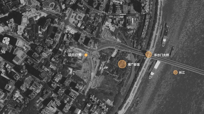 Aerial site plan showing the building locations marked with orange circles along a riverside and highway