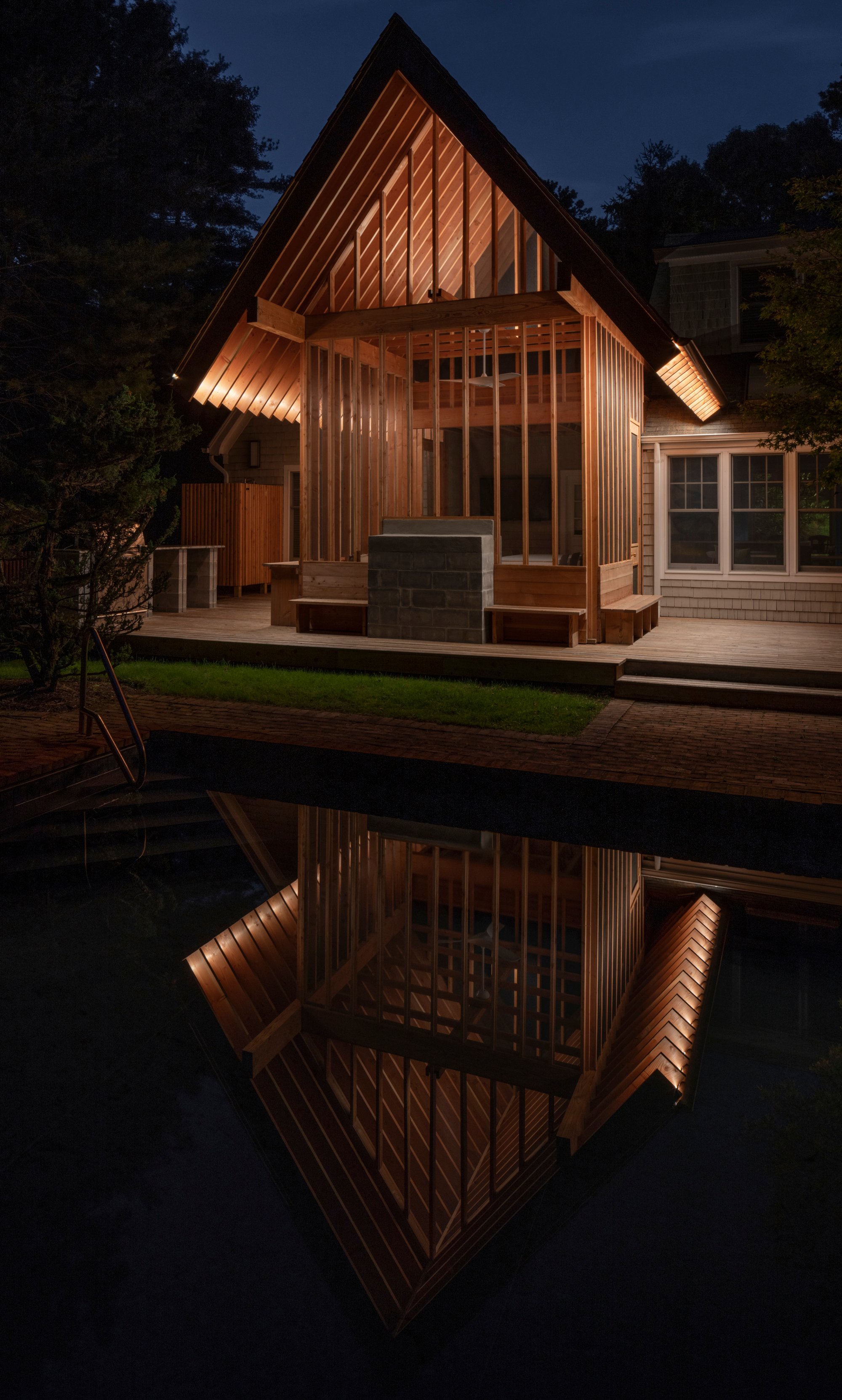 BLDUS Turns a 250-Square-Foot Screened Porch into a Pine Forest Temple in East Hampton