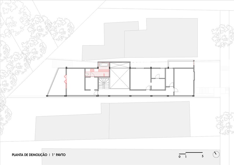 First floor demolition plan drawing showing existing walls and a central staircase with adjacent rooms