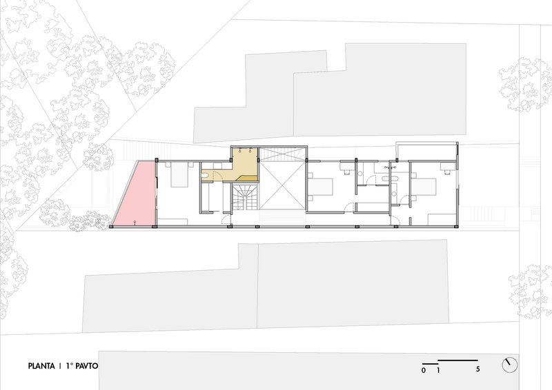 First floor plan drawing showing room layouts with a central staircase and color-coded zones