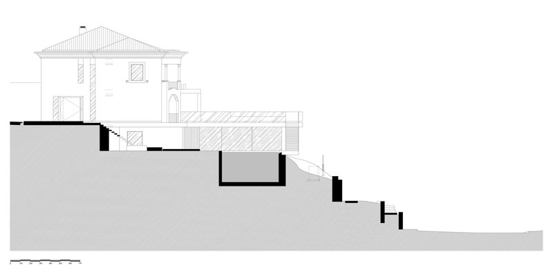 Section drawing showing a house addition extending from an existing building on a descending slope