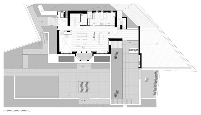 Floor plan drawing showing open living and dining areas with kitchen and exterior courtyard spaces
