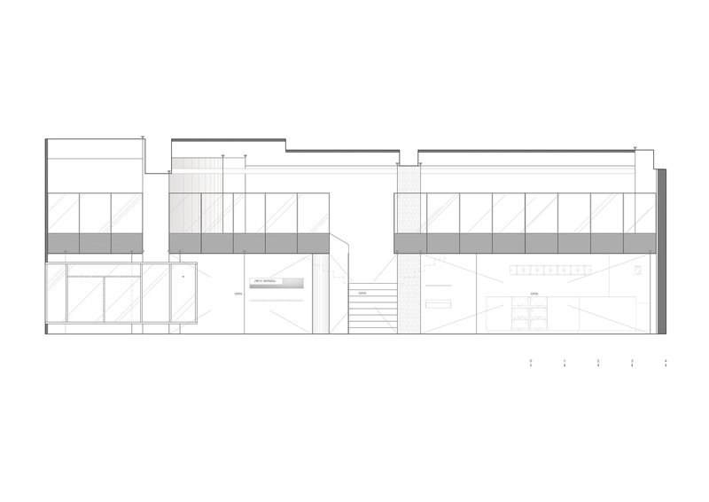 Section drawing showing split-level interiors with a central staircase and built-in shelving units