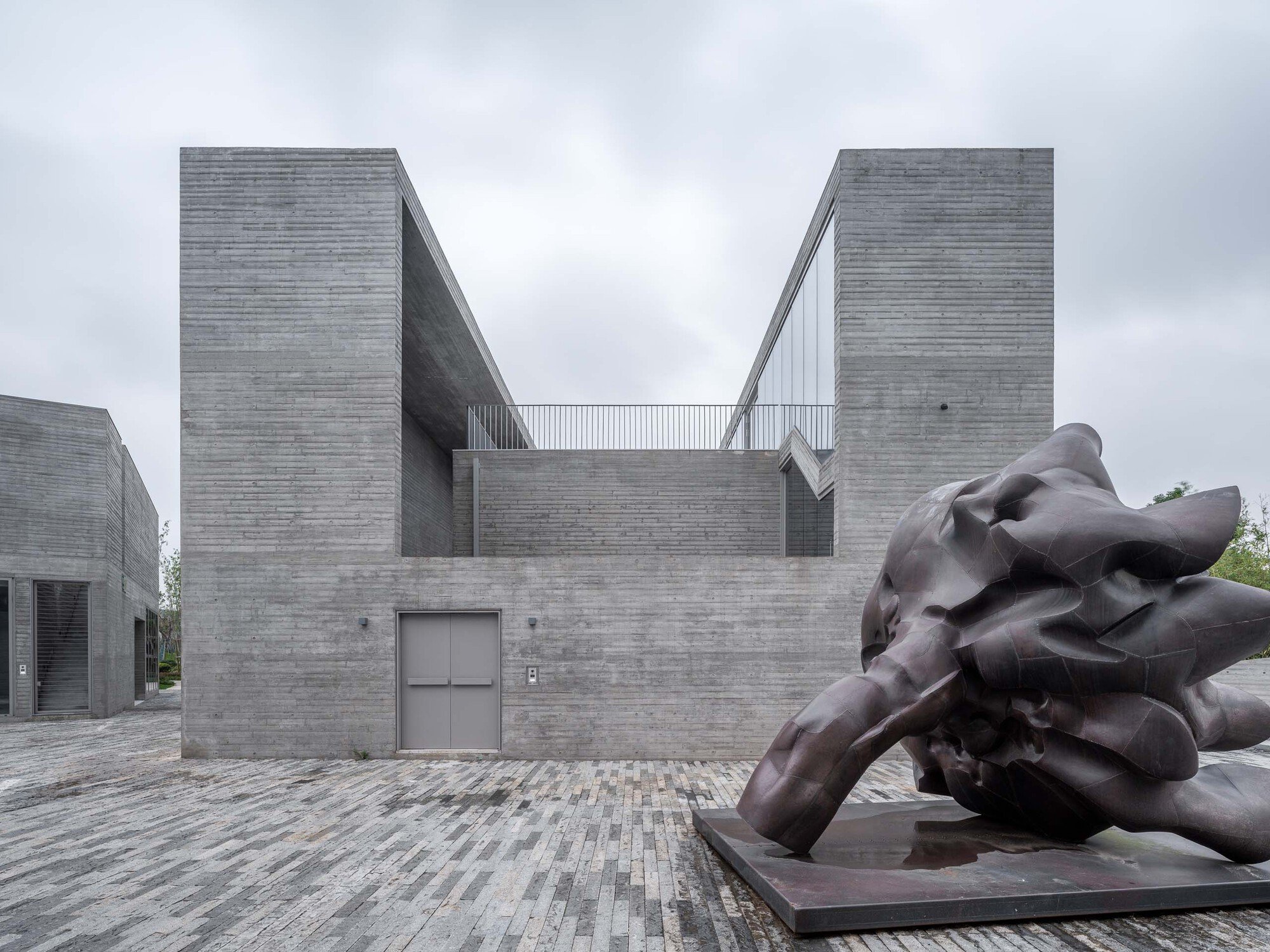 Atelier FCJZ Builds Four Houses That Blur Classicism and Modernism at a Ningbo Lakeside Campus