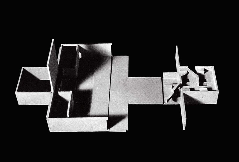 Top-down view of the sectioned physical model revealing interior spatial volumes and walls