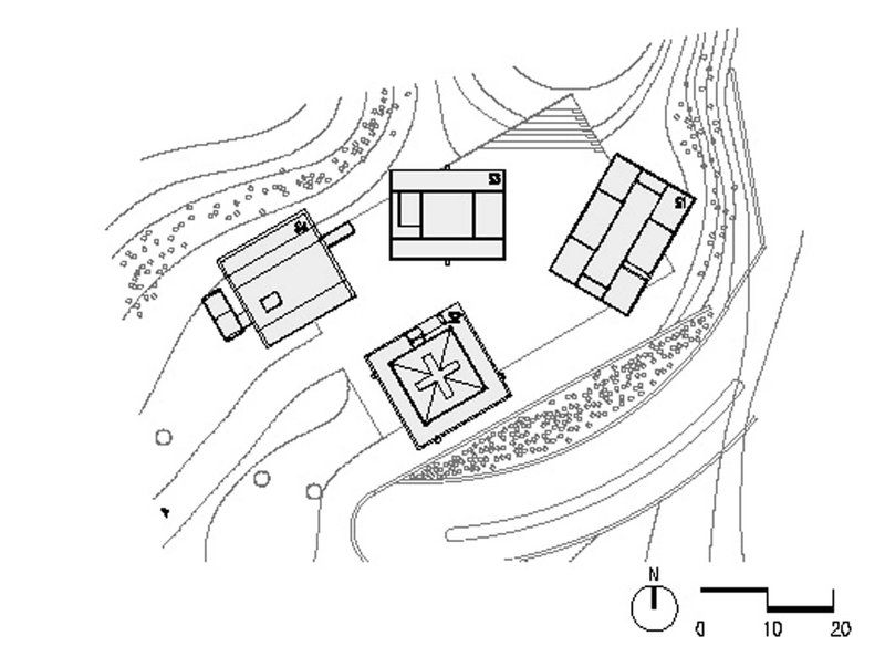 Site plan drawing showing four structures arranged around curving topography and planted areas