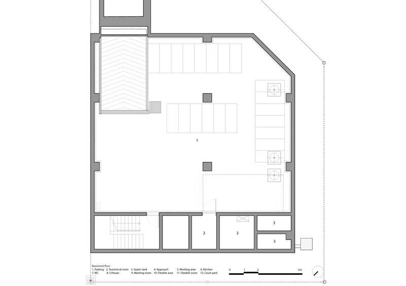 Floor plan drawing showing a garage and central stairwell on the lower level