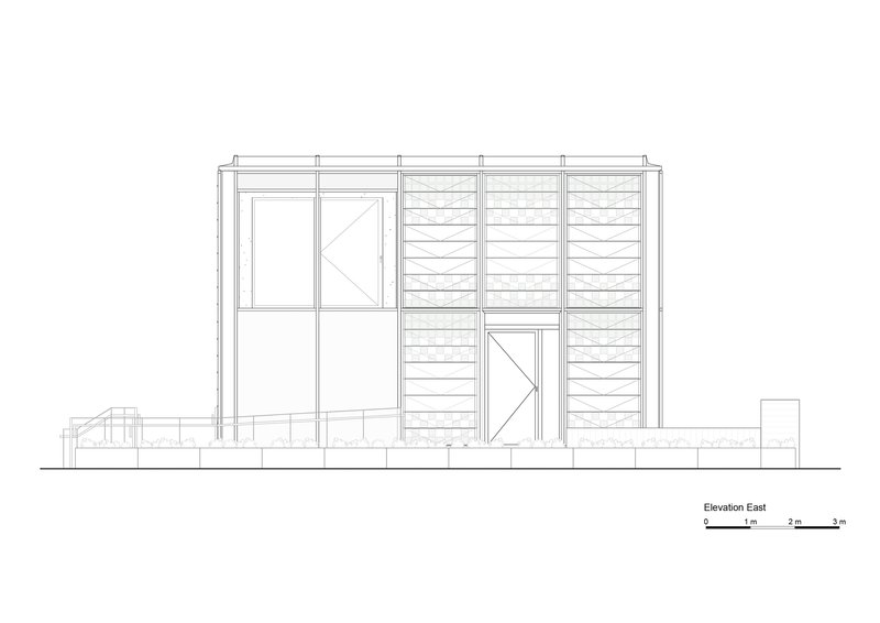 East elevation drawing showing facade with horizontal louvered panels and glazed entry on raised foundation