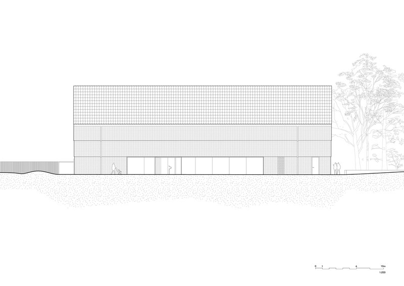 Elevation drawing showing a two-storey rectangular volume with gridded upper facade and adjacent tree