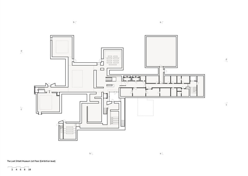Floor plan drawing showing interconnected cubic volumes and a linear gallery wing
