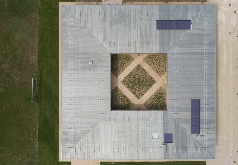 Aerial view of the tiled roof with central courtyard planted in a diagonal grid pattern