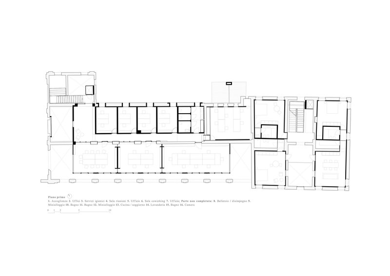 First floor plan drawing showing a long corridor with repeated rooms and open circulation spaces
