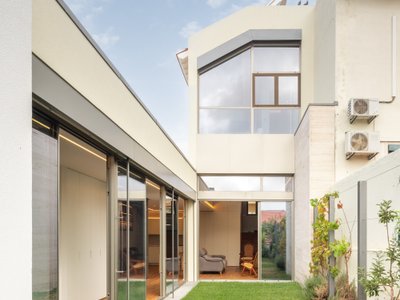Empty Space Architecture Carves Courtyards Through a Lisbon House to Pull the Garden Inside