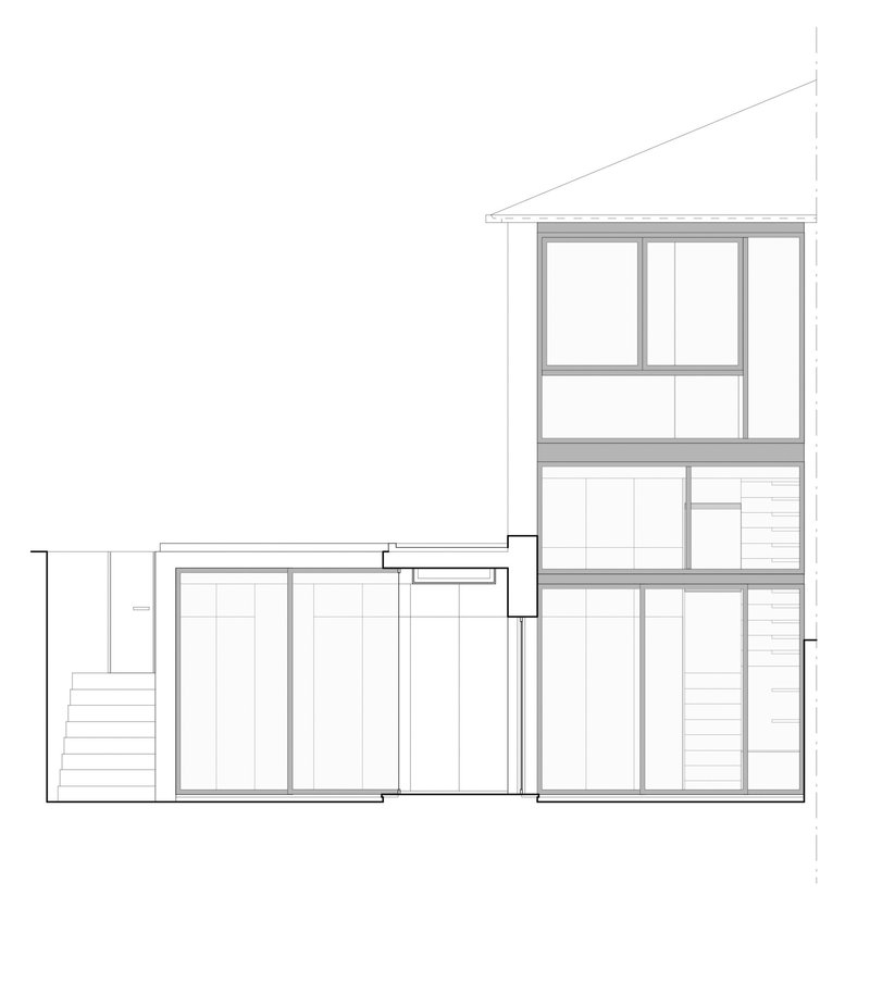 Section drawing through a multi-level residence showing staggered floor plates and window openings