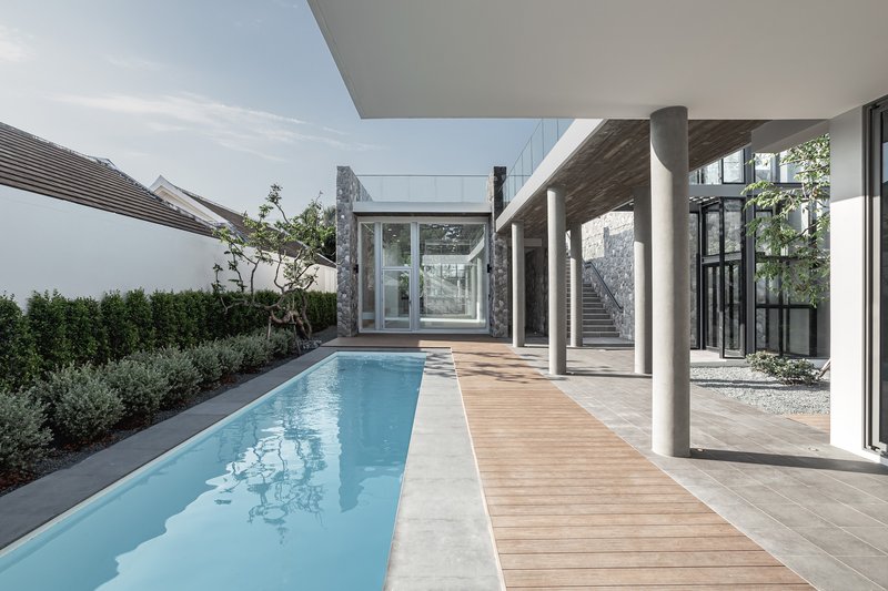 2929 Design Lab Stretches a Walled House Across an 80-Meter Narrow Site in Chiang Mai