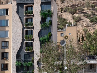 Ashari Architects Disguises a Shiraz Apartment Building as the Mountain Behind It