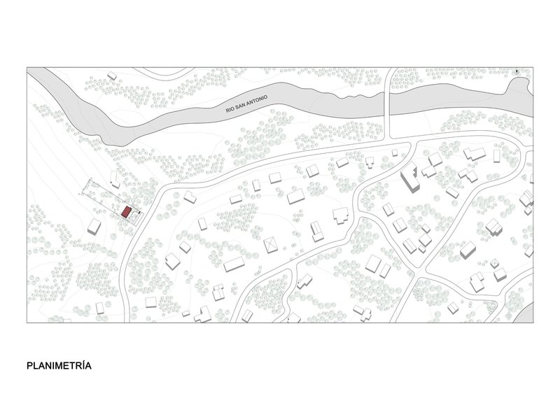 Site plan drawing showing one highlighted structure among scattered buildings and vegetation near a curving river