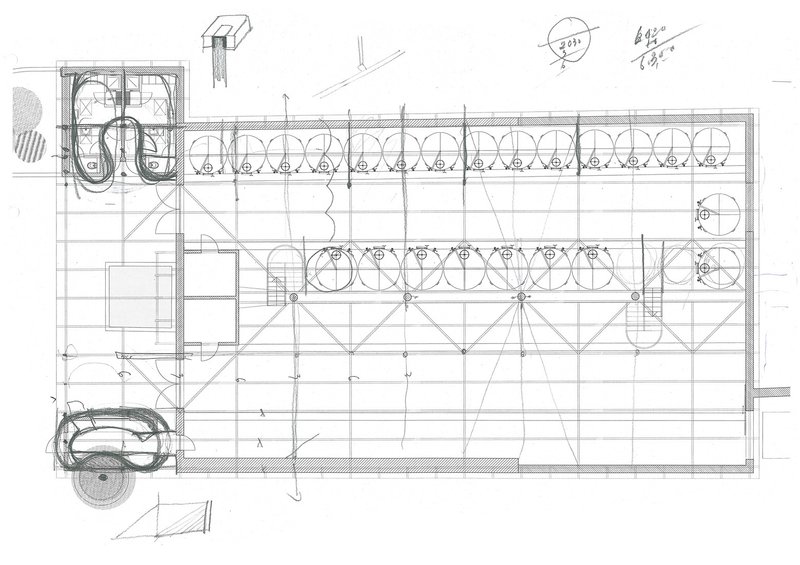 Floor plan drawing showing a rectangular hall with parallel rows of circular tanks and diagonal bracing