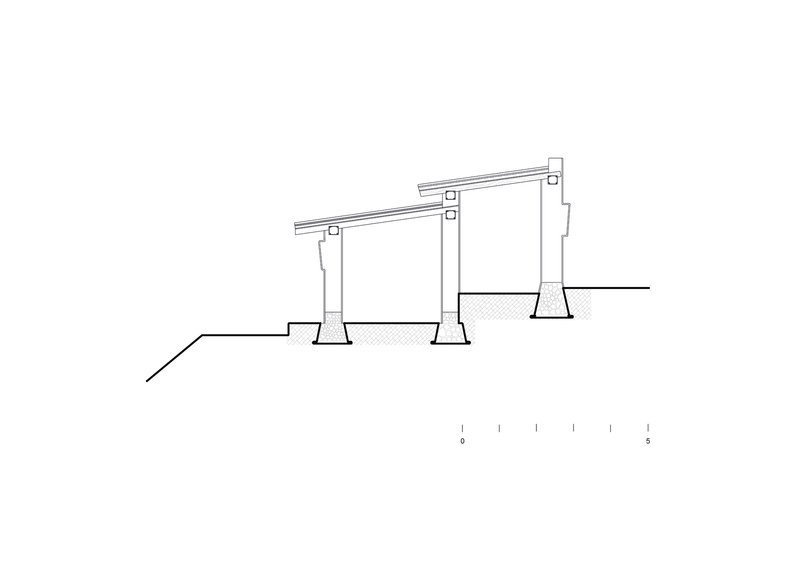 Section drawing showing sloped roof supported by three tapered columns on stepped terrain