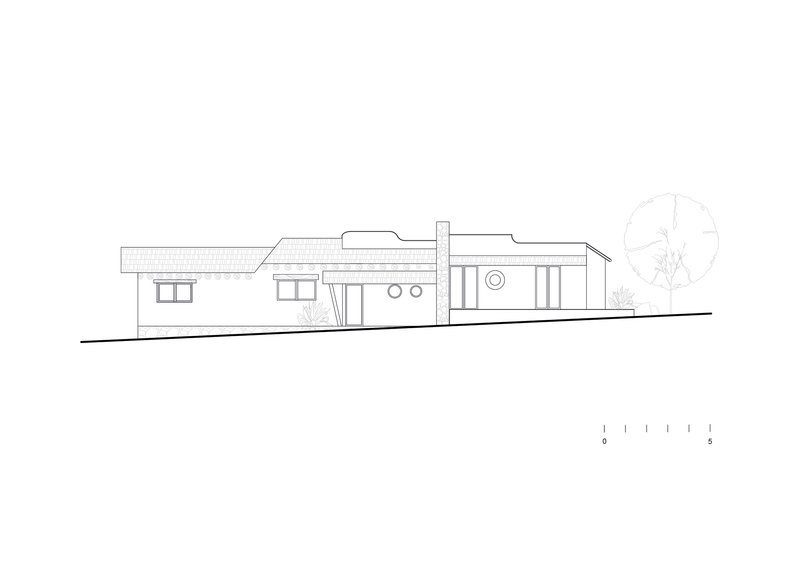 Elevation drawing showing low-pitched roof volumes with circular and rectangular windows and a tree