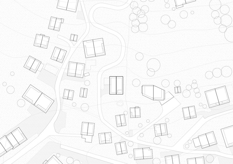 Site plan drawing showing scattered rectangular building footprints along a curving road with trees indicated by circles