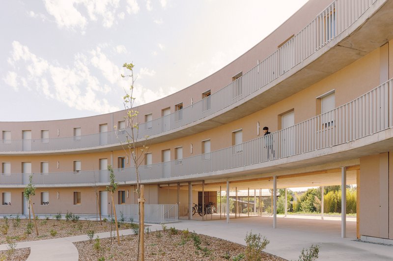 Régis Roudil Wraps 46 Timber-Framed Social Housing Units into a Curved Courtyard Near Toulouse