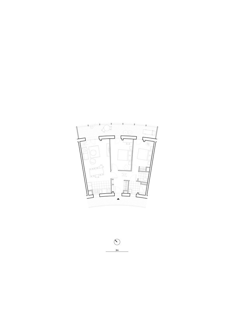 Floor plan drawing showing a residential unit with angled exterior walls and tiled bathroom zones