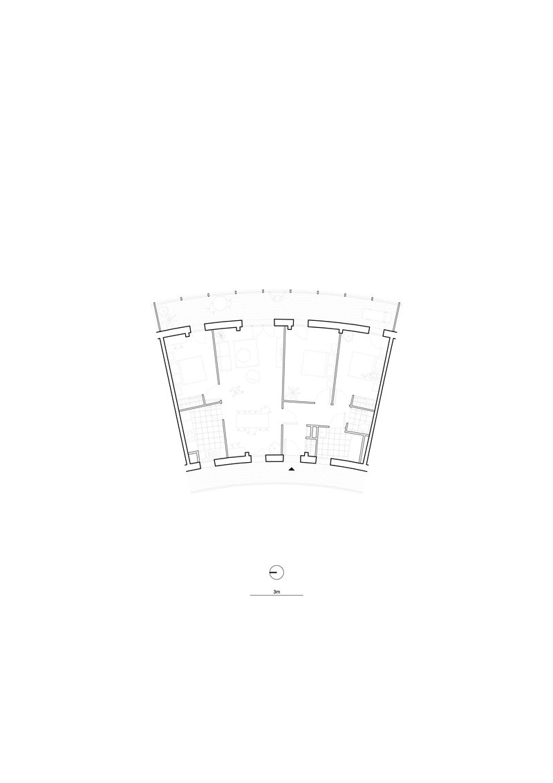 Floor plan drawing showing a dwelling unit with fanning perimeter walls and north orientation marker